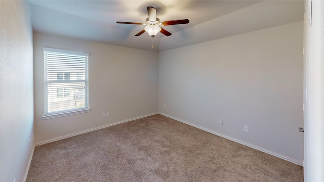 carpeted empty room featuring ceiling fan