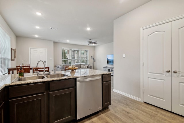 kitchen with light wood-type flooring, stainless steel dishwasher, dark brown cabinetry, ceiling fan, and sink