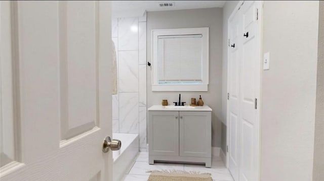 bathroom with vanity and bathing tub / shower combination