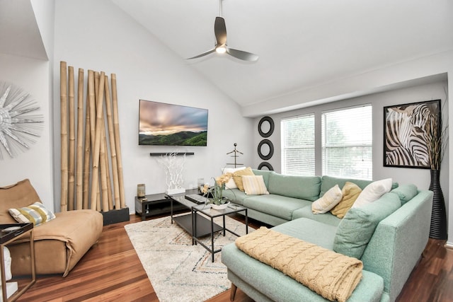 living room featuring dark hardwood / wood-style flooring, high vaulted ceiling, and ceiling fan