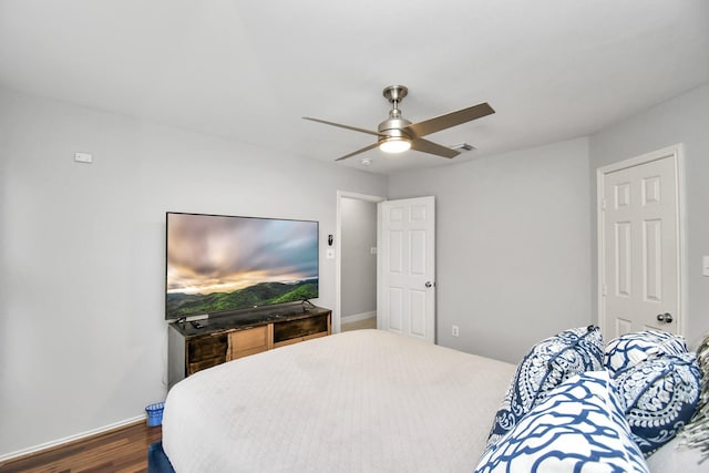 bedroom with ceiling fan and dark wood-type flooring