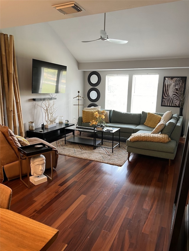 living room featuring ceiling fan, vaulted ceiling, and hardwood / wood-style flooring