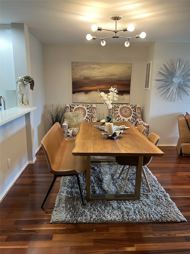 dining space featuring sink and dark hardwood / wood-style floors