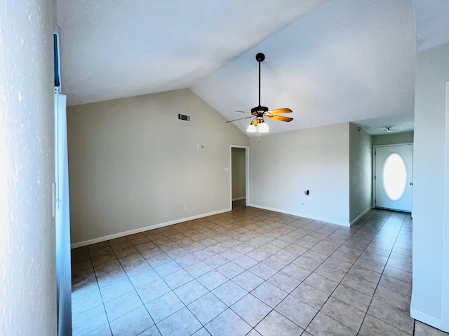 interior space featuring ceiling fan, light tile patterned floors, and lofted ceiling