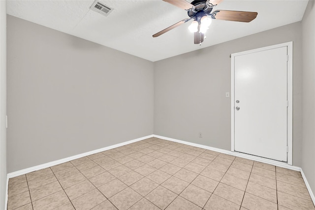 spare room with ceiling fan