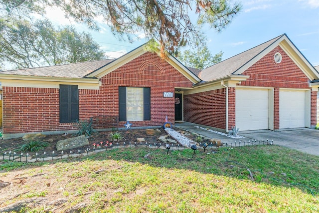 view of front of property with a garage and a front lawn