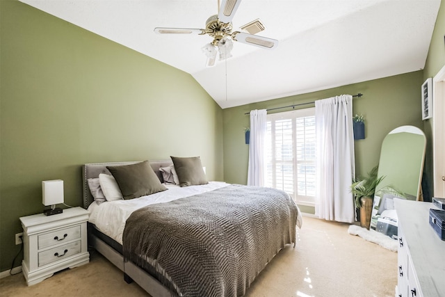 carpeted bedroom featuring ceiling fan and lofted ceiling