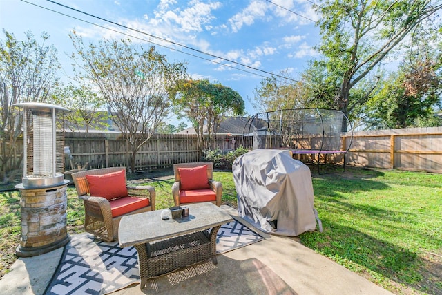 view of patio with a grill and a trampoline