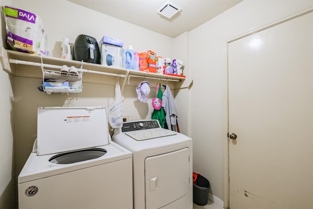 laundry area with washer and clothes dryer