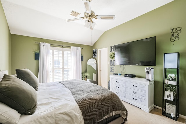 bedroom featuring ceiling fan, light colored carpet, and lofted ceiling