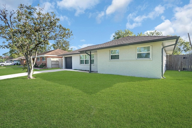 single story home with a garage and a front lawn