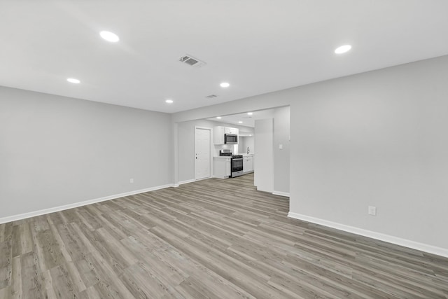 unfurnished living room with light wood-type flooring