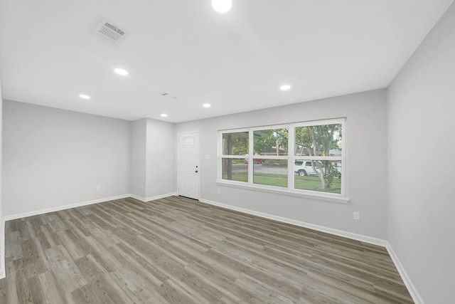 unfurnished room featuring light wood-type flooring