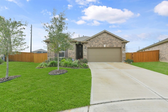 view of front of home featuring a garage and a front yard