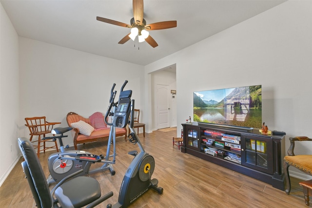 exercise area with ceiling fan and hardwood / wood-style floors