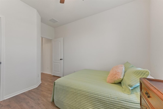 bedroom featuring hardwood / wood-style flooring and ceiling fan