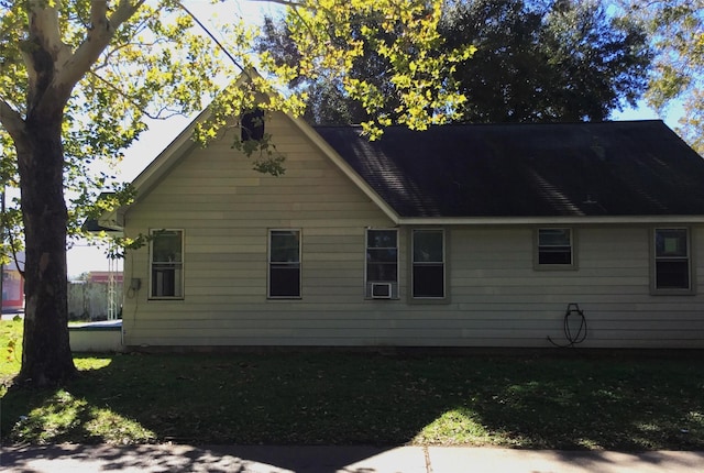 view of home's exterior with a yard