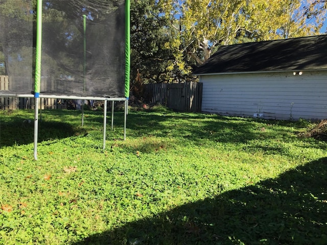 view of yard with a trampoline