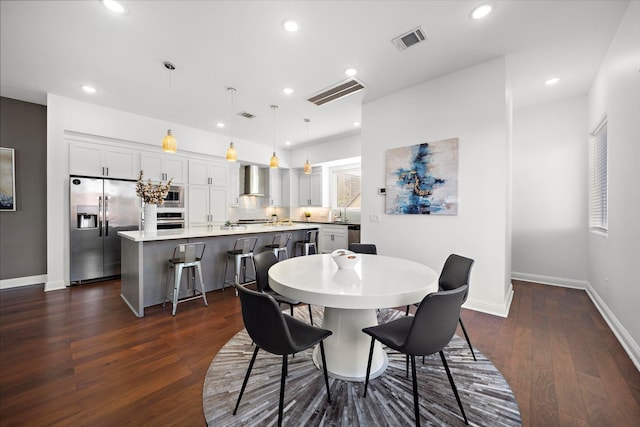 dining room featuring dark wood-type flooring