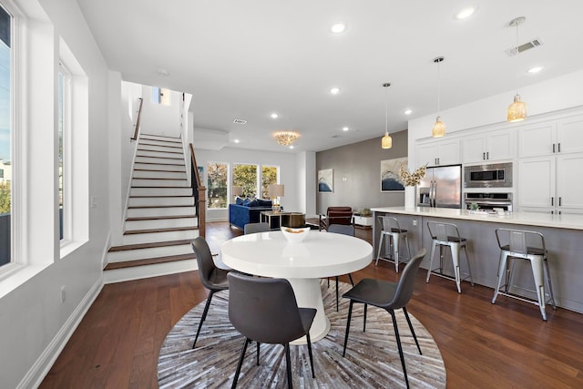 dining area with dark wood-type flooring