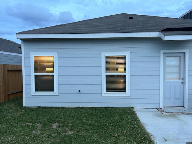 view of side of property featuring a yard