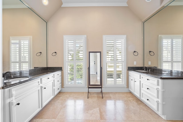 bathroom with vanity, high vaulted ceiling, and ornamental molding