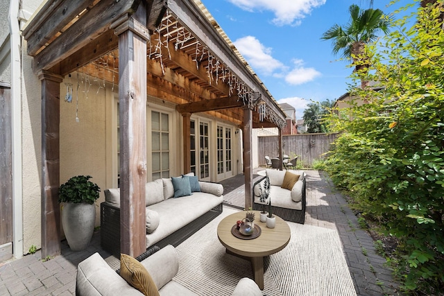 view of patio with outdoor lounge area and french doors