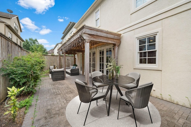 view of patio with french doors and an outdoor living space