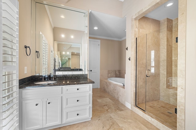 bathroom featuring shower with separate bathtub, vanity, and crown molding