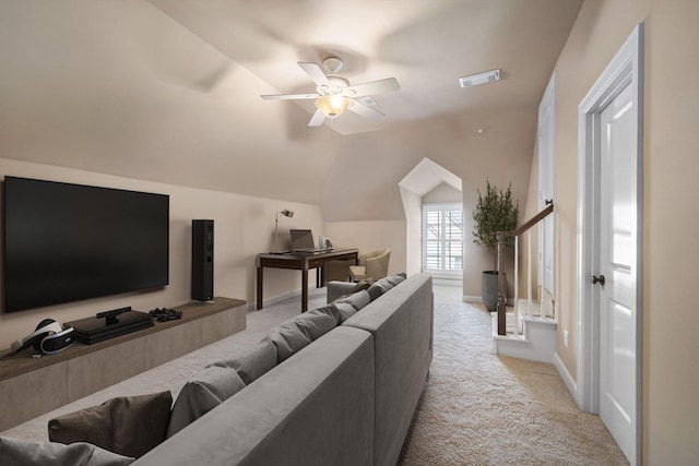 carpeted living room featuring ceiling fan and vaulted ceiling