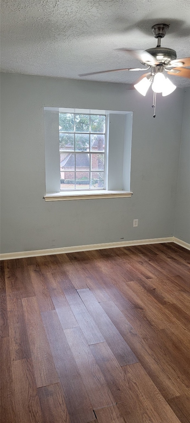 spare room featuring ceiling fan, a textured ceiling, and hardwood / wood-style flooring