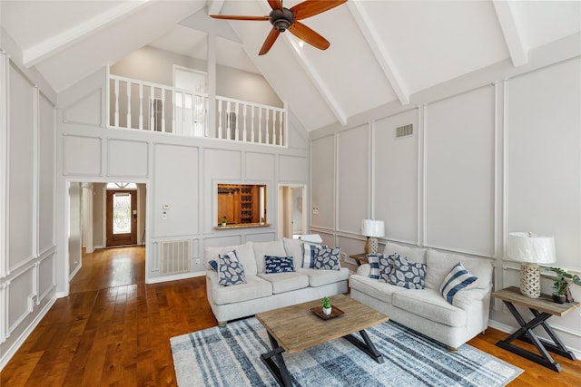 living room with beam ceiling, ceiling fan, dark hardwood / wood-style flooring, and high vaulted ceiling