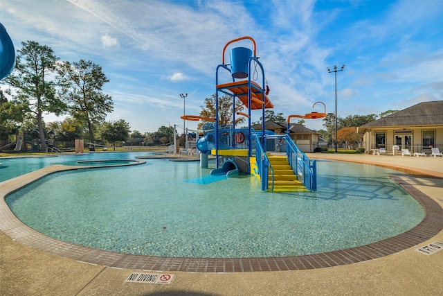 view of pool featuring a water slide