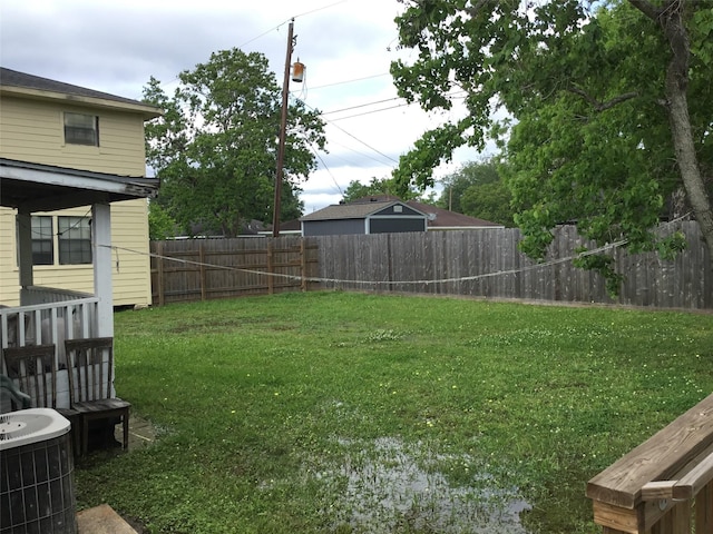 view of yard featuring central air condition unit