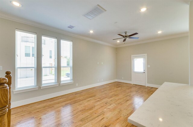 interior space with crown molding, light hardwood / wood-style flooring, and ceiling fan