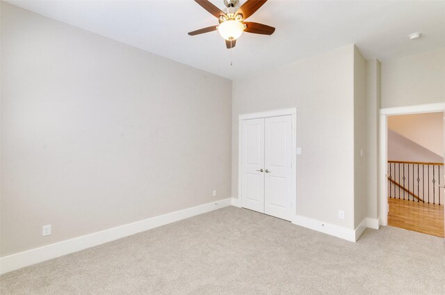 carpeted empty room with ceiling fan