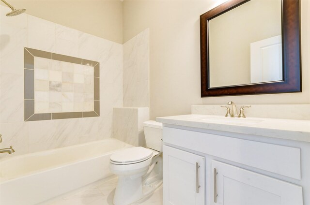 full bathroom with vanity, tiled shower / bath combo, and toilet