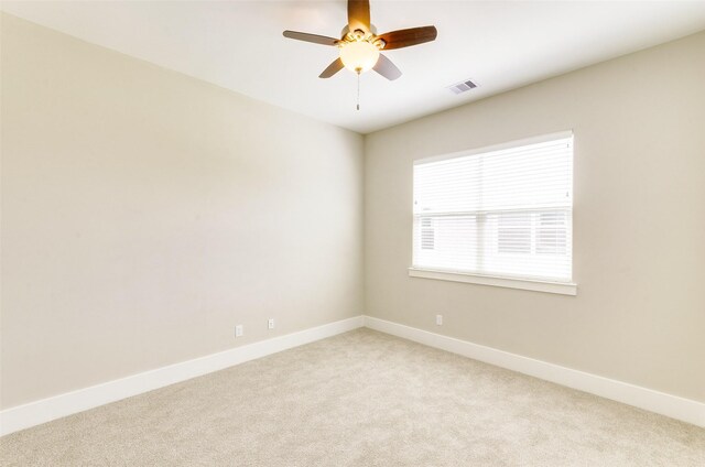 empty room with light carpet and ceiling fan