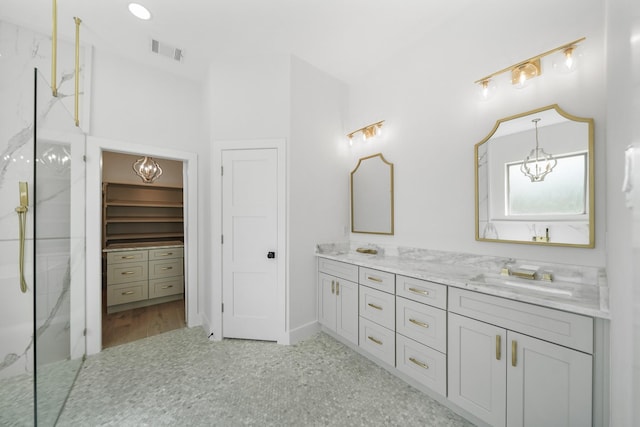 bathroom with vanity and walk in shower