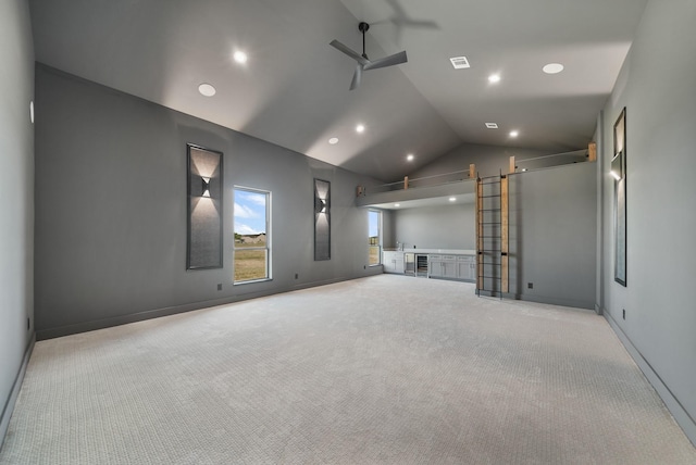 home theater room featuring light carpet, high vaulted ceiling, and ceiling fan