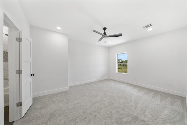 carpeted empty room with ceiling fan