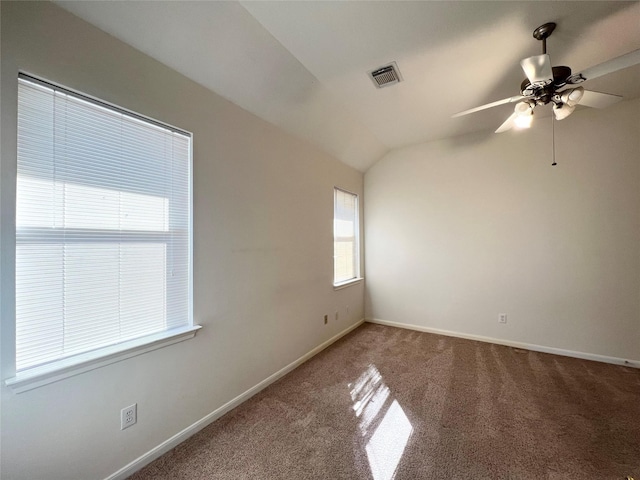 unfurnished room with ceiling fan, carpet floors, and vaulted ceiling