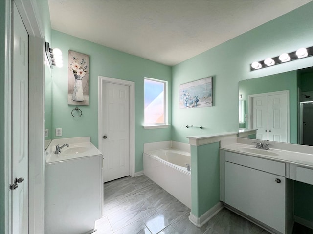 bathroom with a bathing tub and vanity