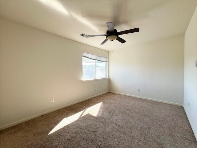 carpeted empty room with ceiling fan