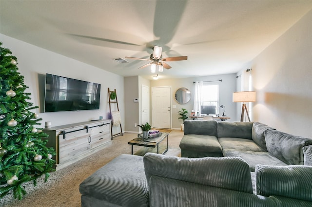 living room with ceiling fan and light colored carpet