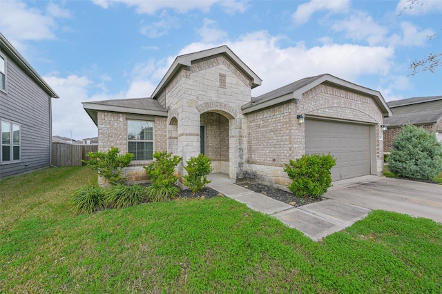 view of front facade with a front yard and a garage