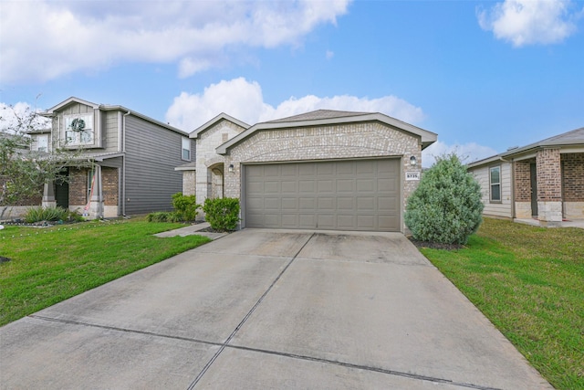 view of front of house featuring a front yard and a garage