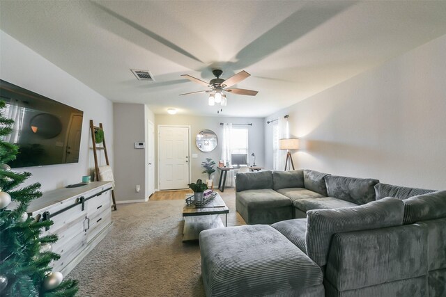 living room featuring light colored carpet and ceiling fan