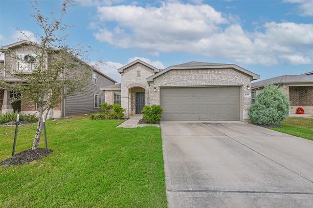 view of front of property with a front lawn and a garage