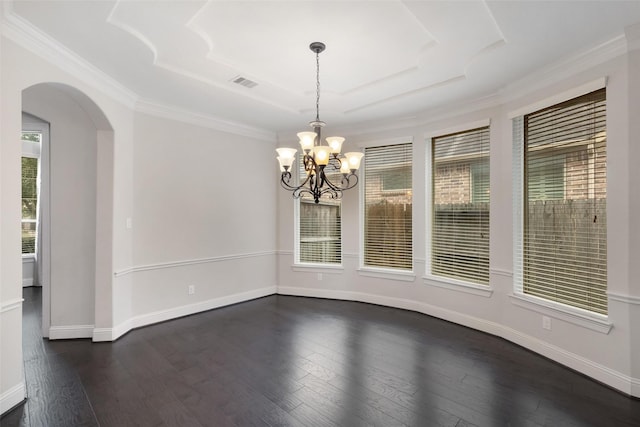 unfurnished dining area featuring a notable chandelier, dark hardwood / wood-style flooring, and ornamental molding